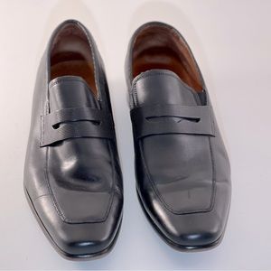 Genuine black leather dress shoe.